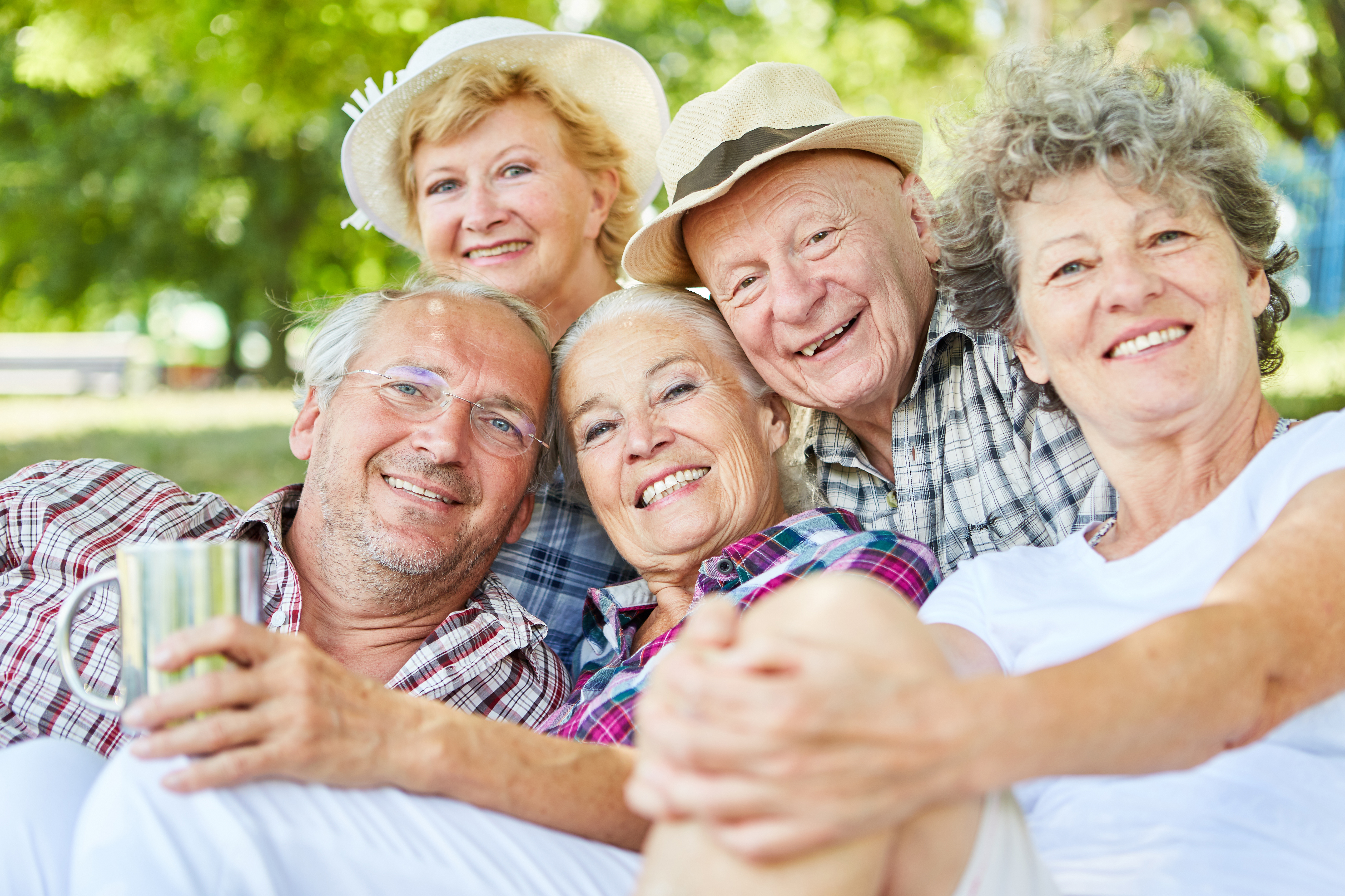 elderly group together smiling for photo