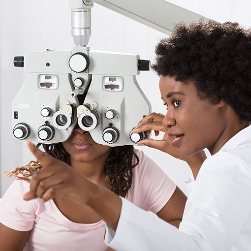 Eye doctor performing eye exam